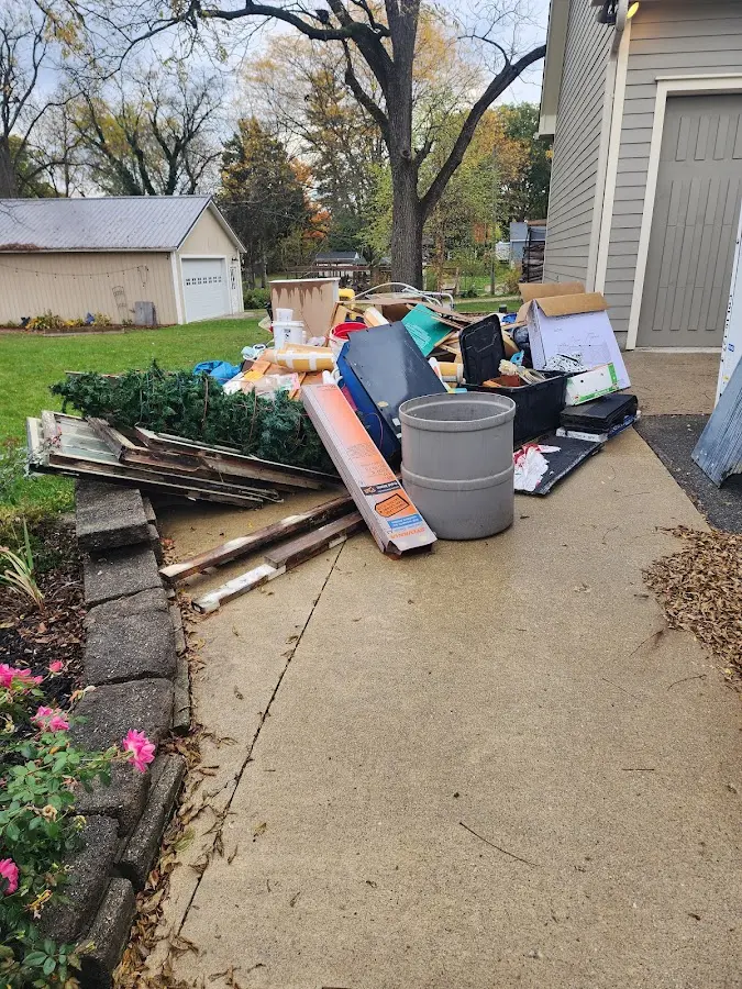 Dumpster being loaded with debris for Estate Cleanout Dumpster Rental in Francisville